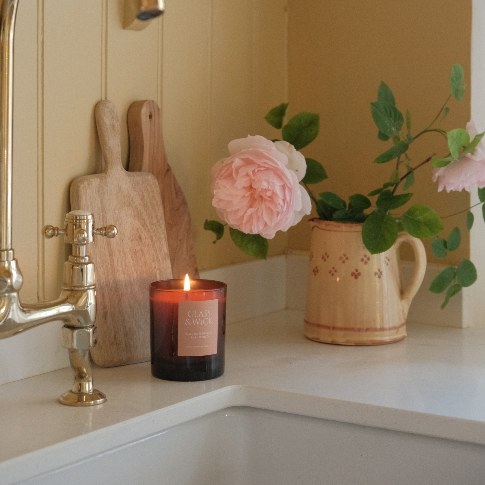 golden peach and almond candle by glass and wick