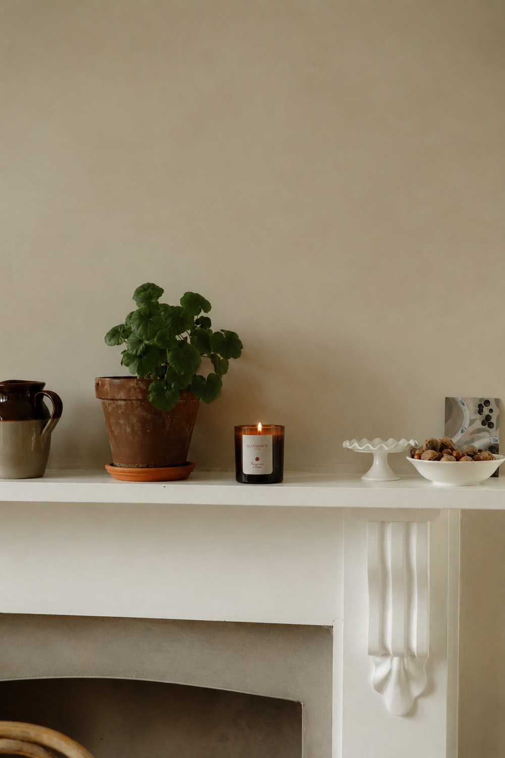 Pomegranate & Cassis amber candle on mantelpiece 