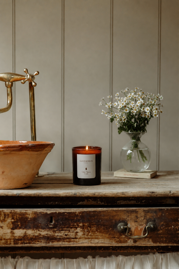 cuban tobacco & oak amber scented candle on rustic solid wood vanity unit