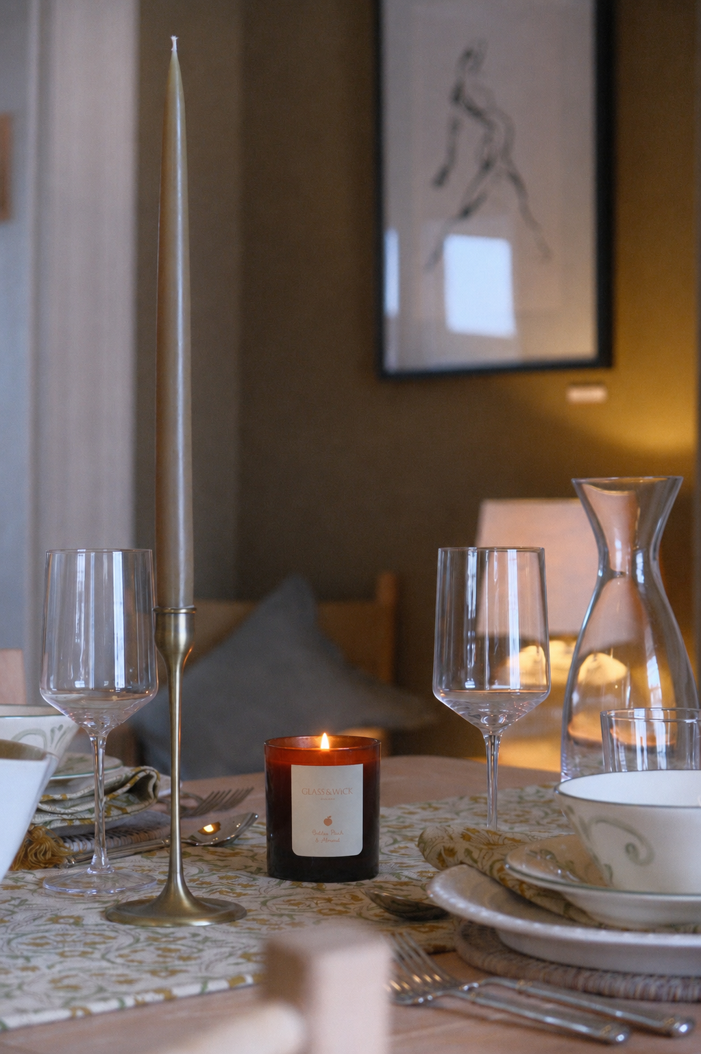 golden peach & almond scented amber candle by glass & Wick. 