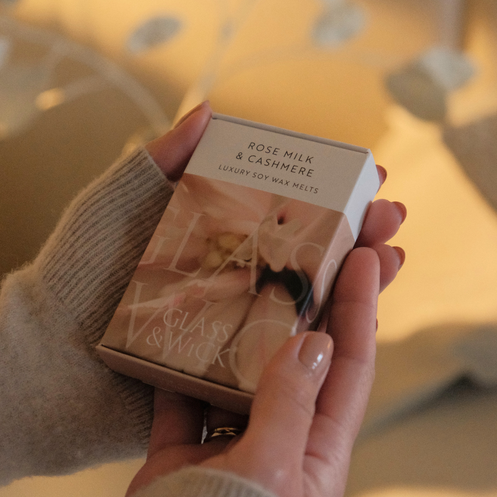 rose milk and cashmere wax melts by glass and wick